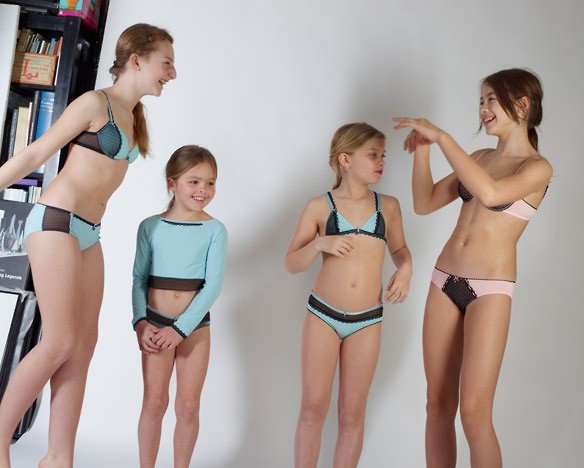 four giggling young girls in underwear