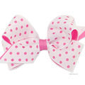 Small white grosgrain laser dot overlay bow with matching wrap.