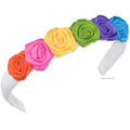 Six bright grosgrain rolled roses on a grosgrain wrapped headband.