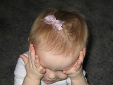 Below, Presley is wearing our Audrey Baby Bow in Pink.